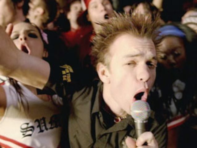 who is this girl?  behind the guy
