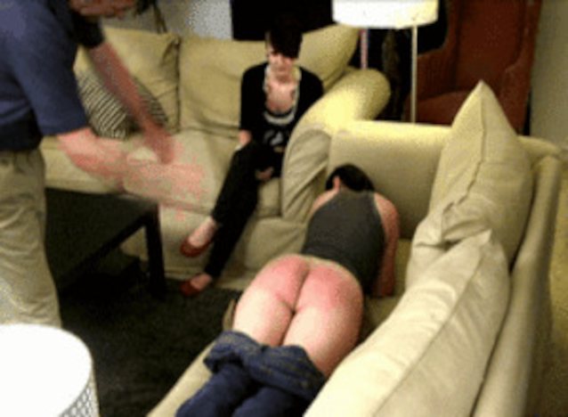 Who is the lady being spanked? 