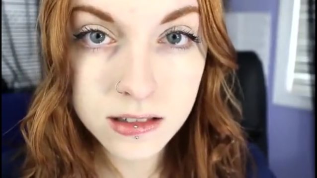 redhead blue eyed woman piercing