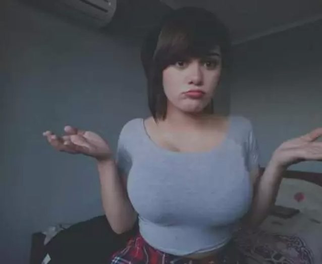 big breasts clothed indoors
