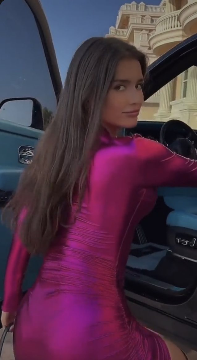 brunette, pink dress, car, dancing