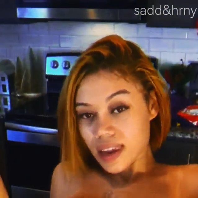 ebony, orange hair, light skin, kitchen