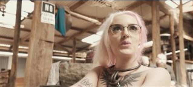 pink blond hair, glasses, tattoo, chain