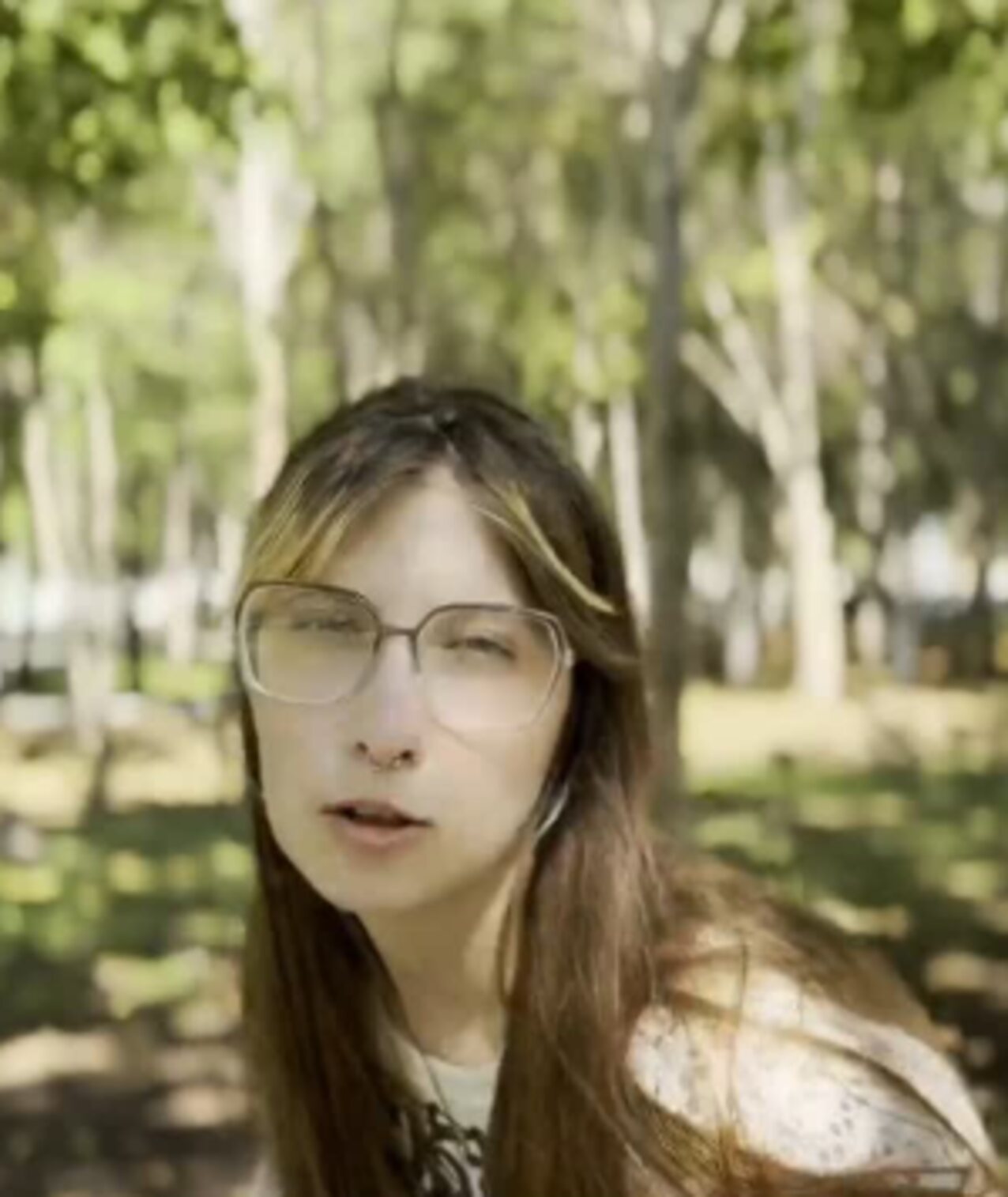 glasses brown hair nose piercing