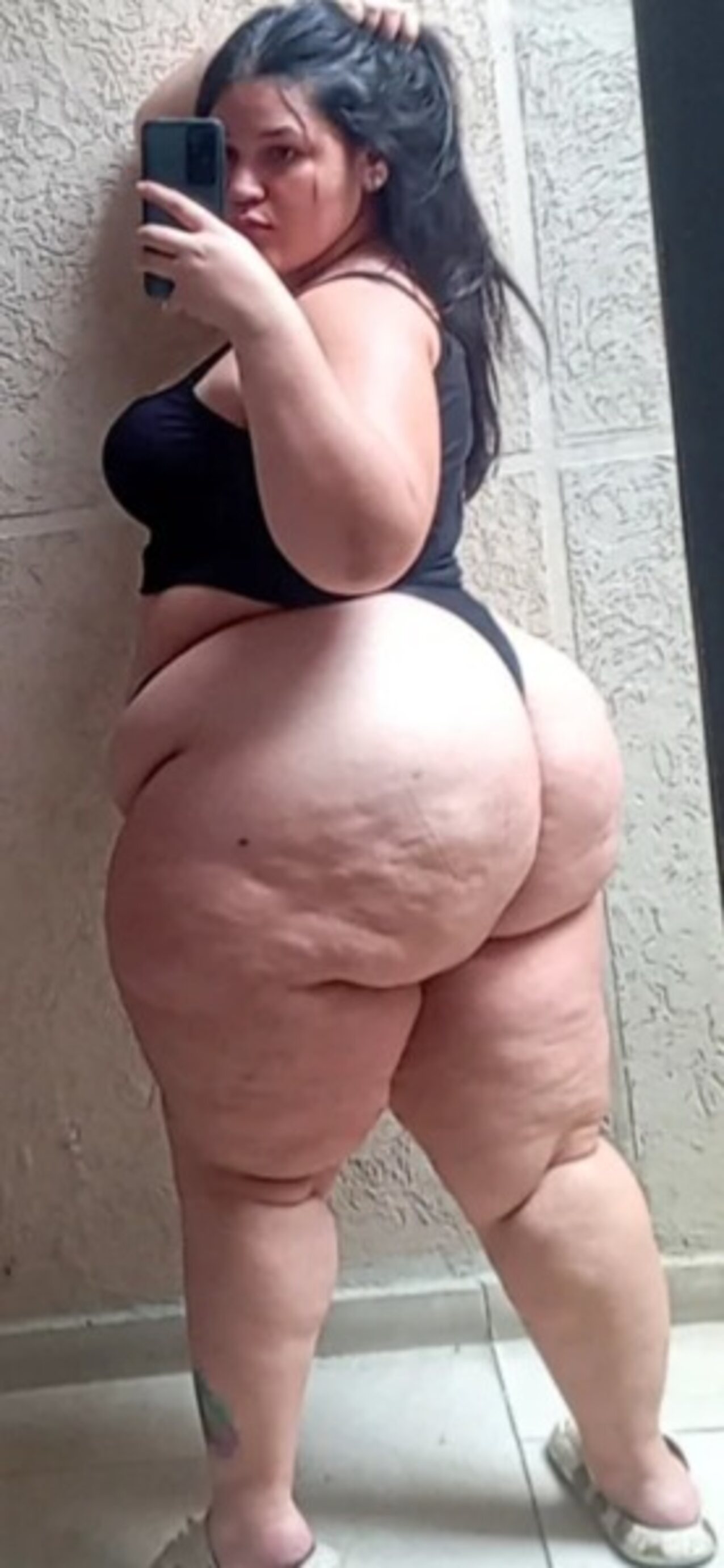 cell phone left leg tattoo selfie