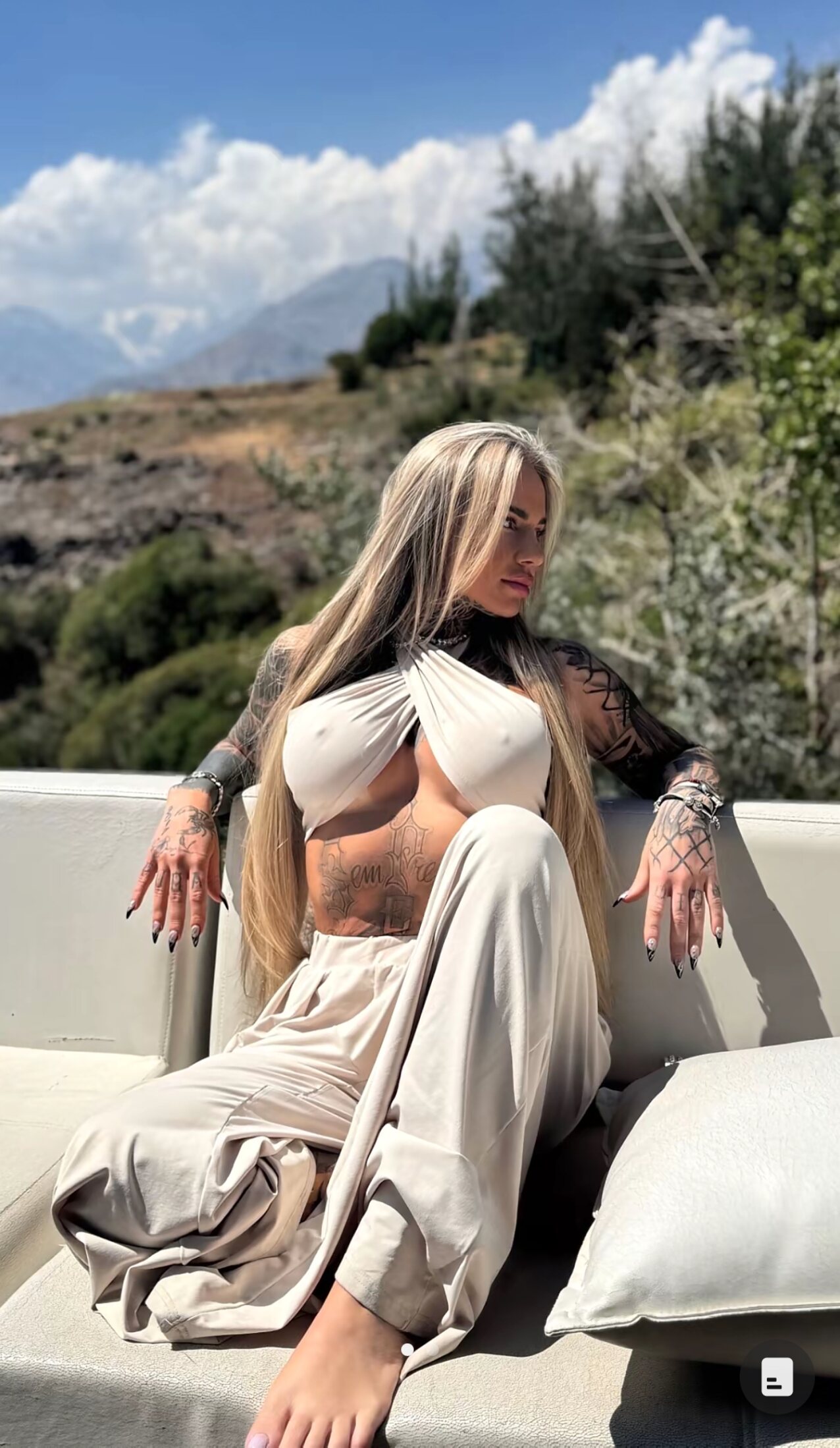 blonde tattoos boobs