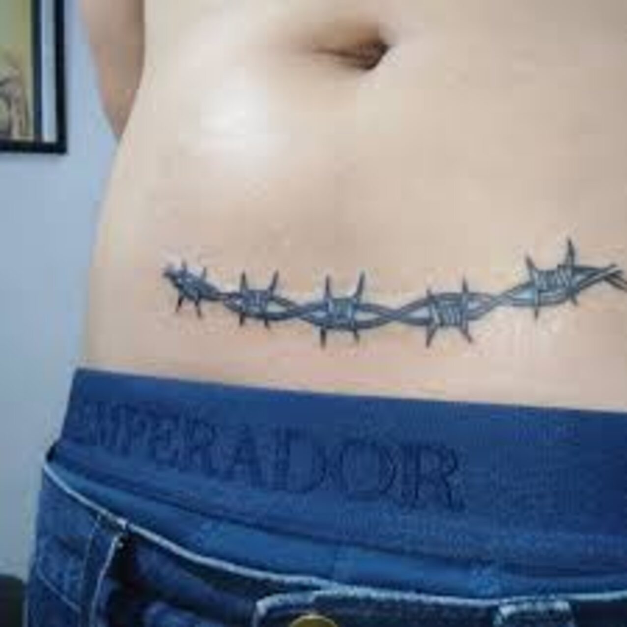 blonde barbed wire tattoo