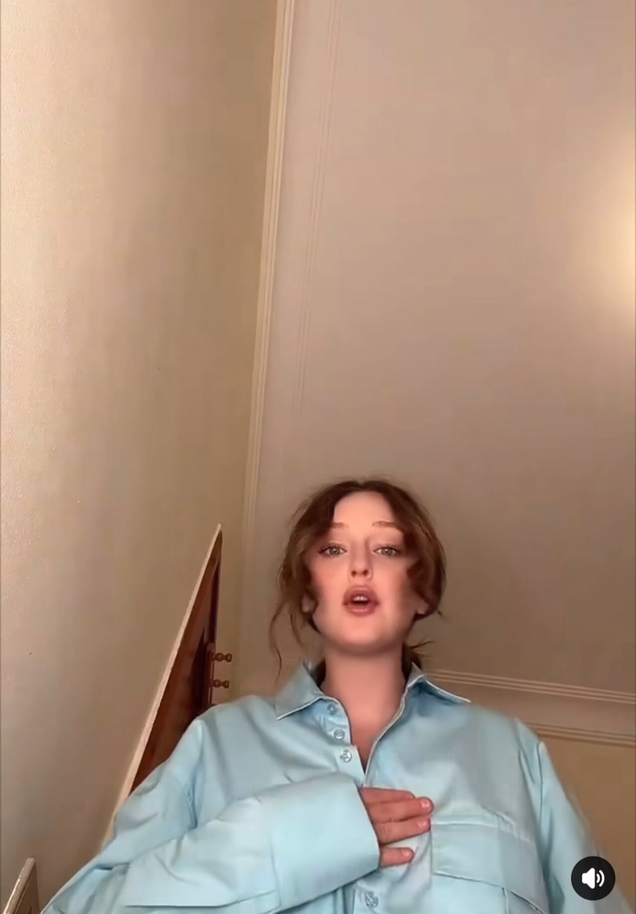 white blonde sitting on camera