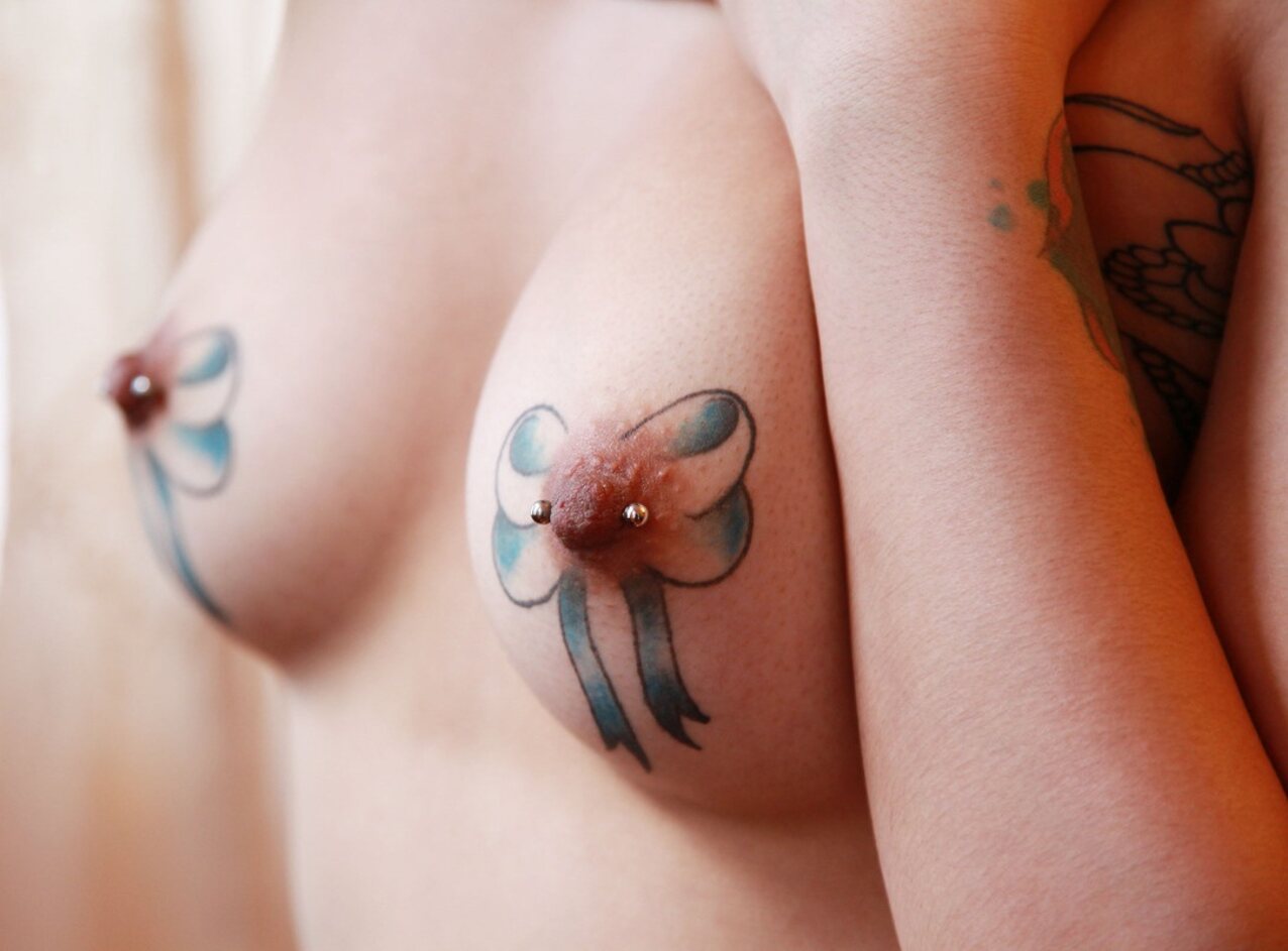 tattoos ribbons nipple tattoo