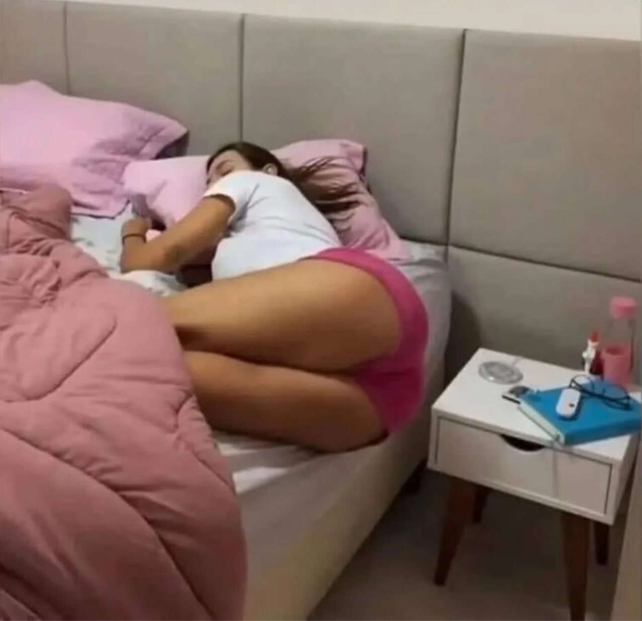 bed sleeping brunette