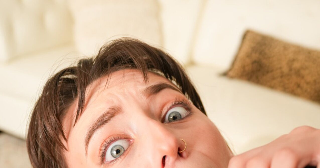 brunette brown hair green eyes
