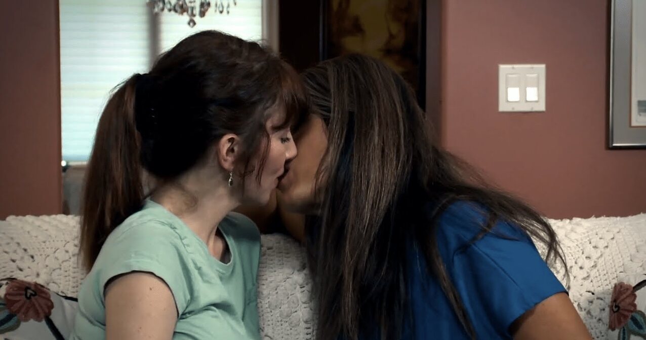 lesbian kissing couch