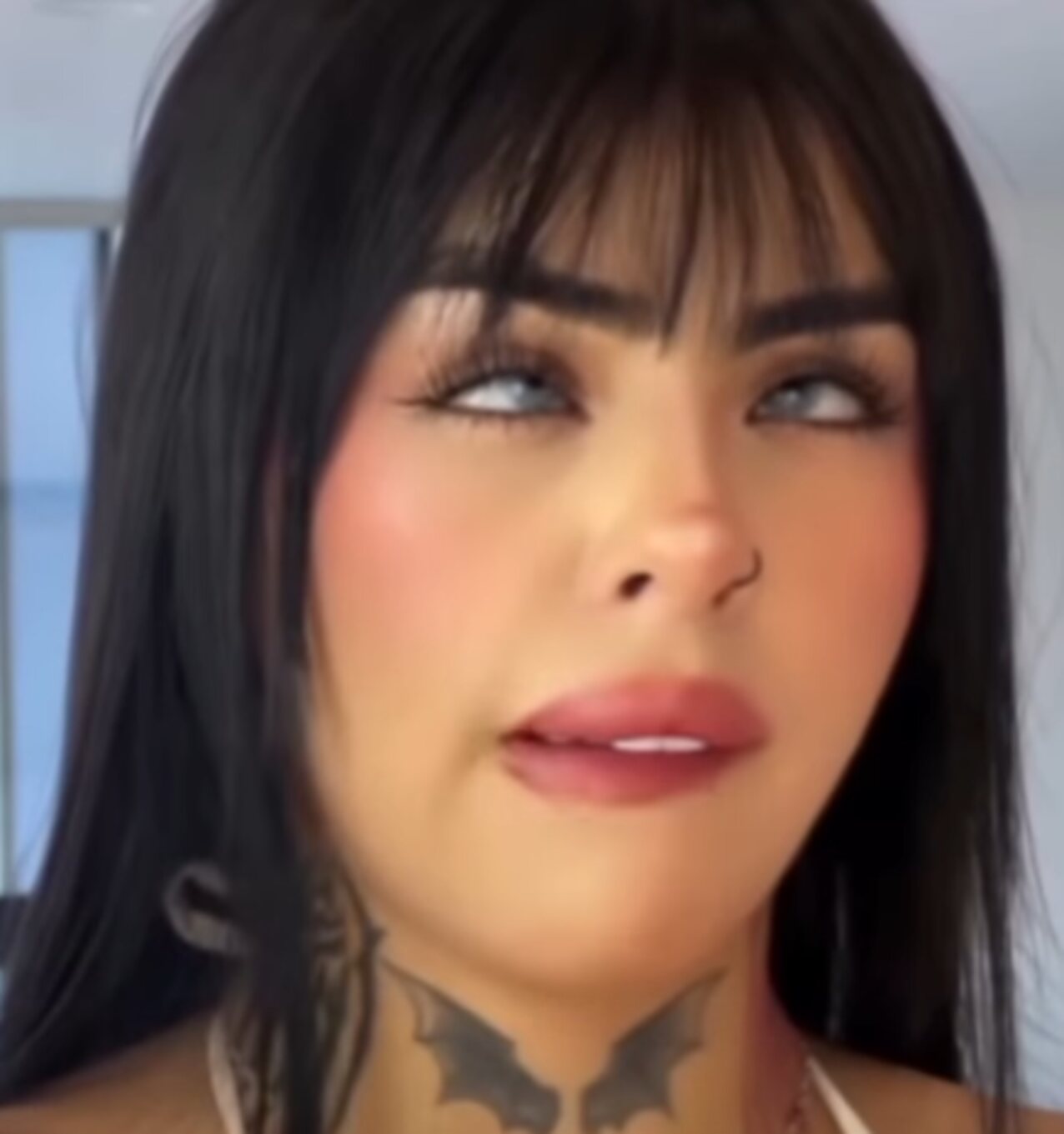 brunette neck tattoo turning eyes