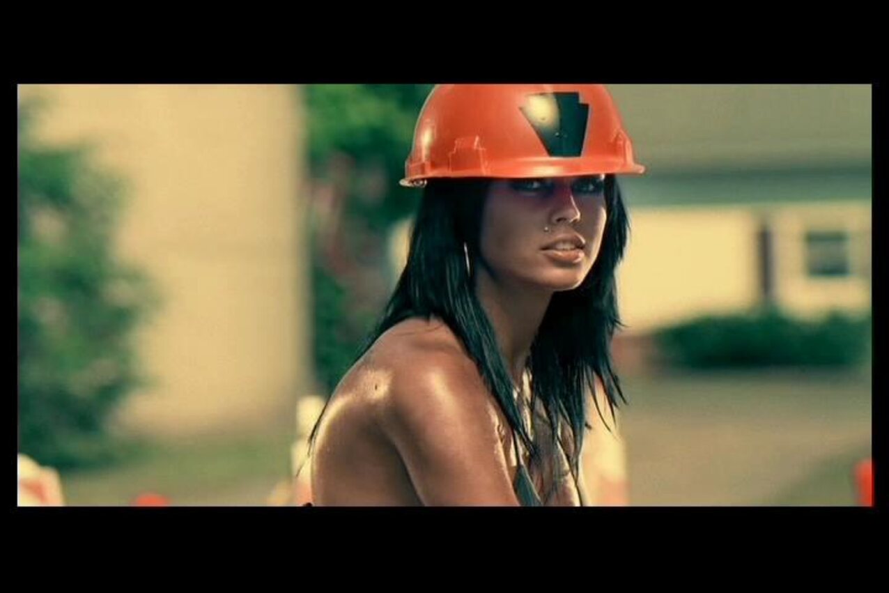 piercing brunette concrete worker