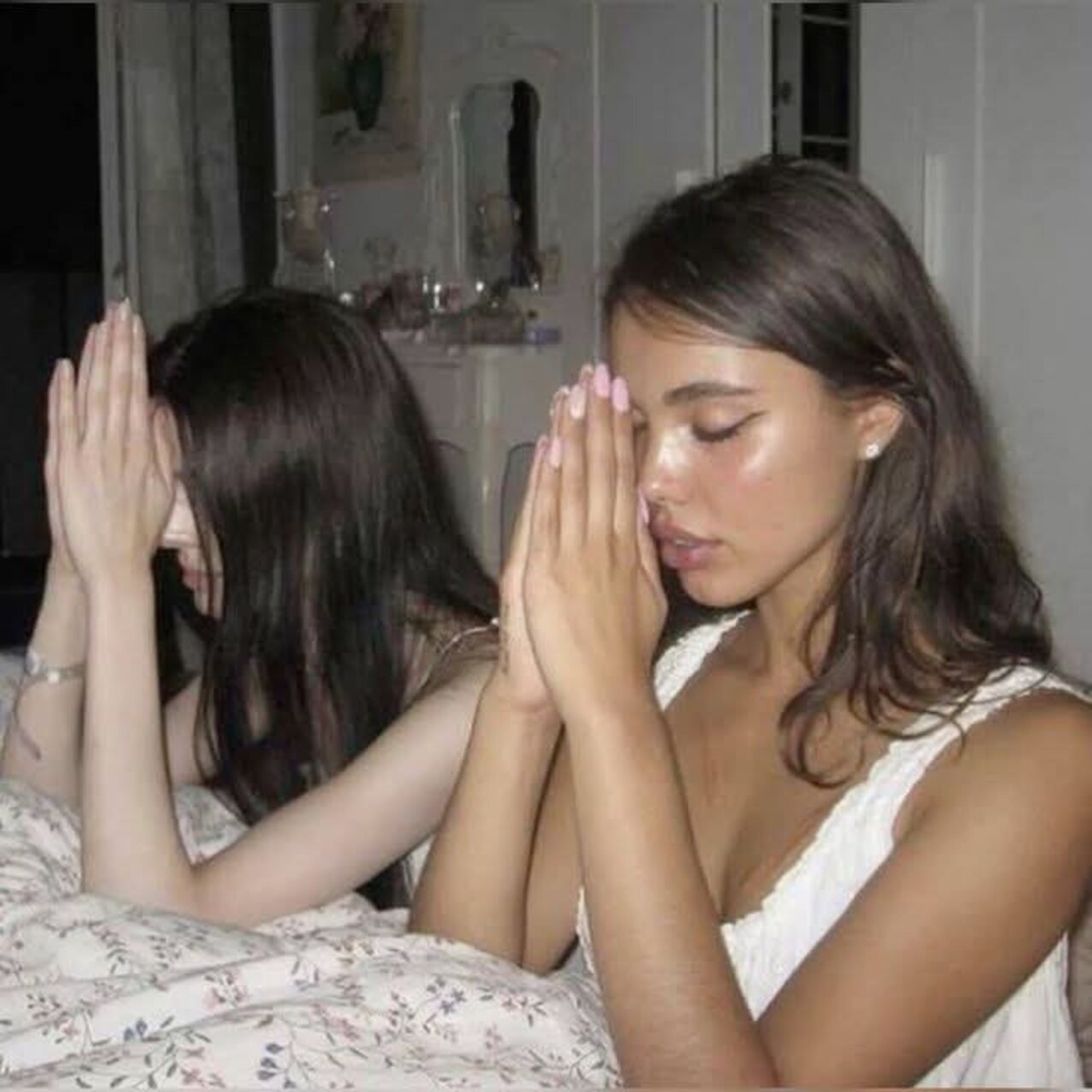 two praying girls
