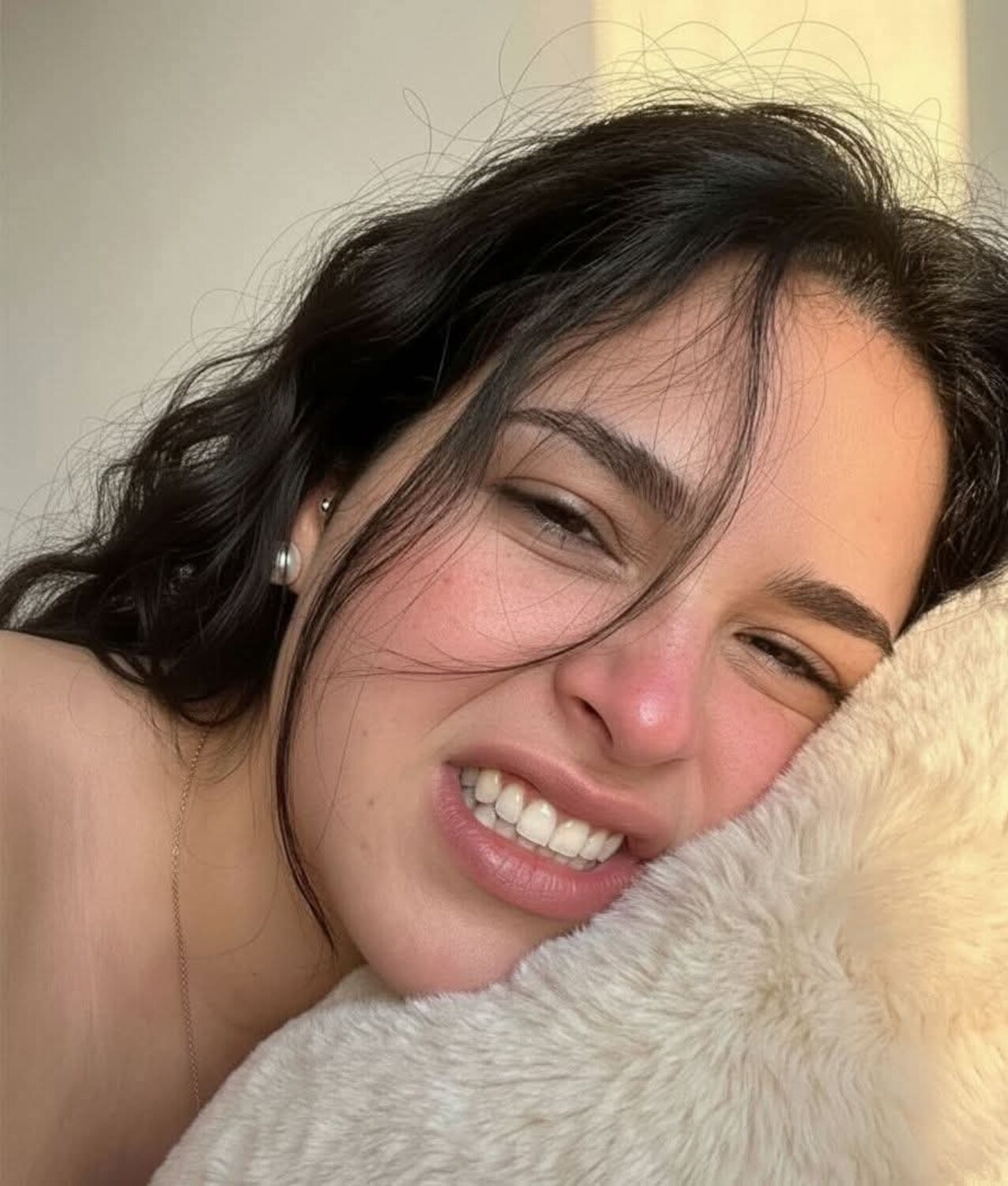 dark hair wavy hair smiling