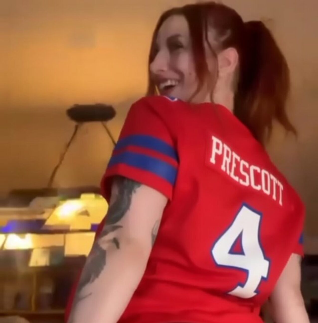 redhead tattoo football shirt