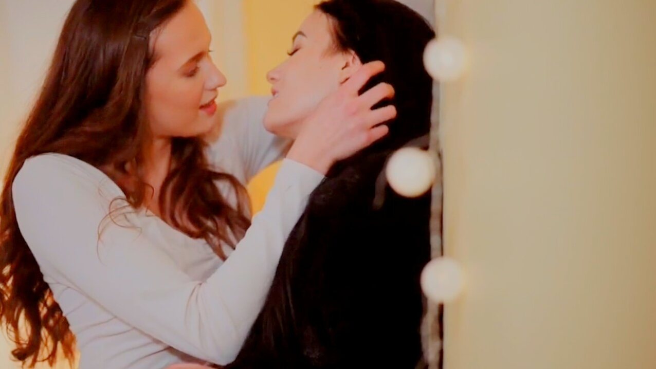 lesbian kissing standing