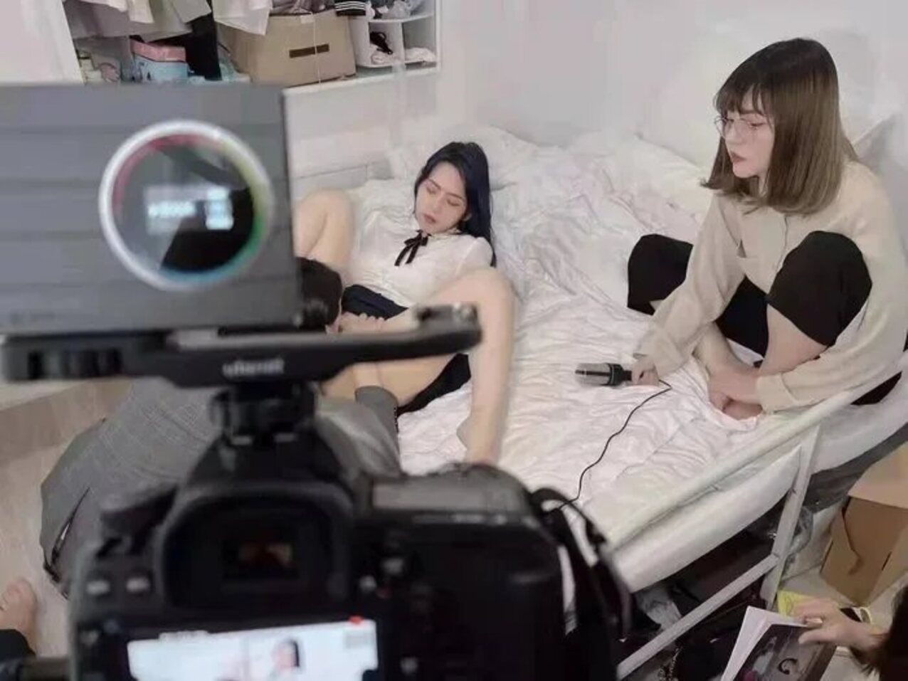two girls filming set behind the scenes