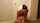 brunette striping striptease