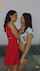 kissing red dress dark hair