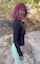 short pink hair a black long shirt sky blue leggings