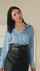 black hair blue blouse another woman
