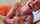 orange dress handjob closeup